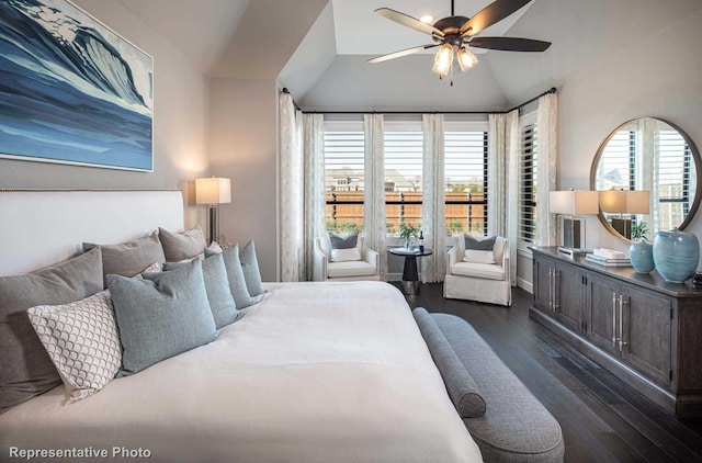 bedroom featuring ceiling fan, vaulted ceiling, and dark hardwood / wood-style flooring