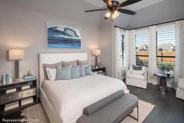 bedroom featuring ceiling fan, lofted ceiling, and dark hardwood / wood-style flooring