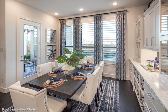 dining area featuring dark hardwood / wood-style flooring