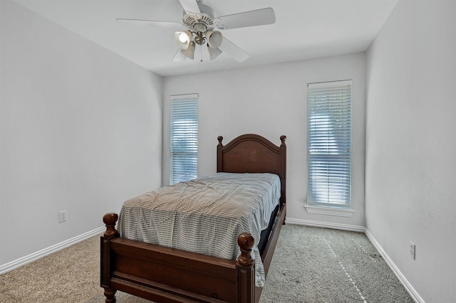 bedroom with light carpet and ceiling fan