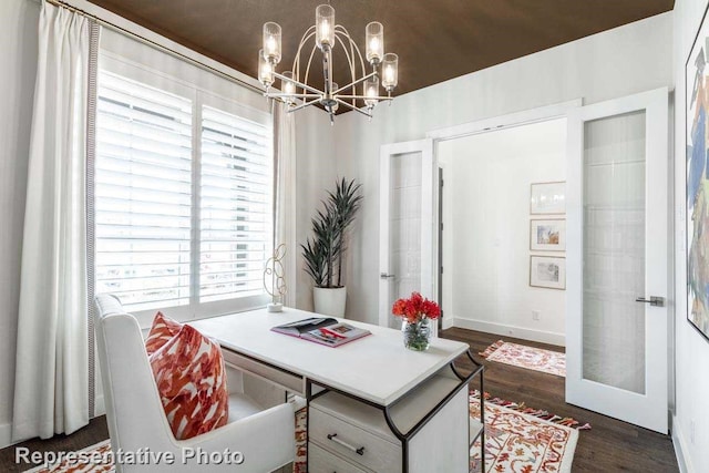 office space featuring an inviting chandelier and dark hardwood / wood-style flooring