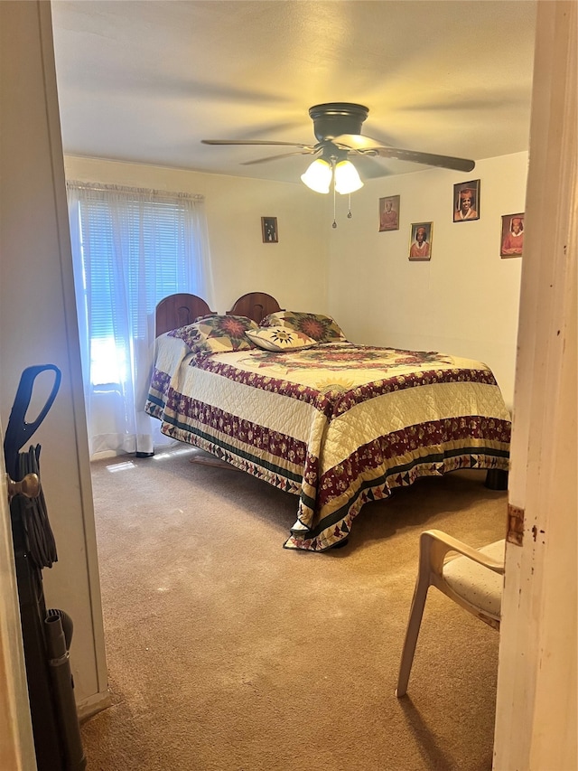 bedroom with ceiling fan and carpet floors