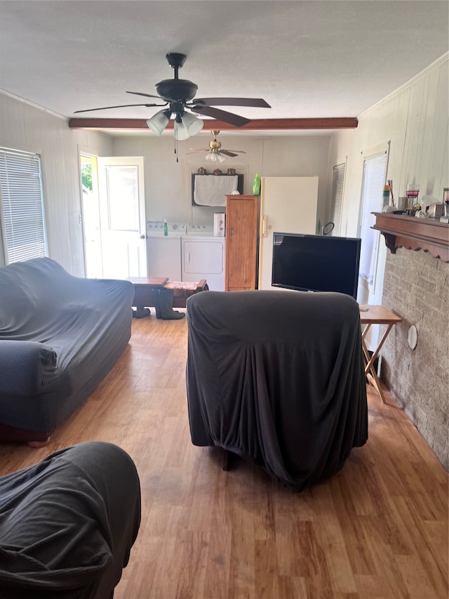 bedroom with ceiling fan, light wood-type flooring, and washing machine and clothes dryer