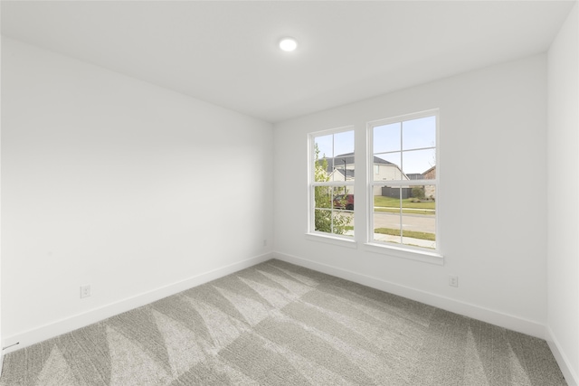 unfurnished room featuring carpet floors