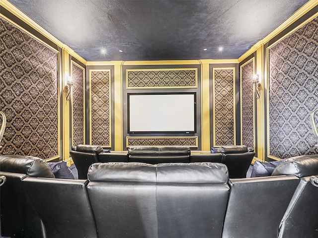 home theater room with crown molding and a textured ceiling