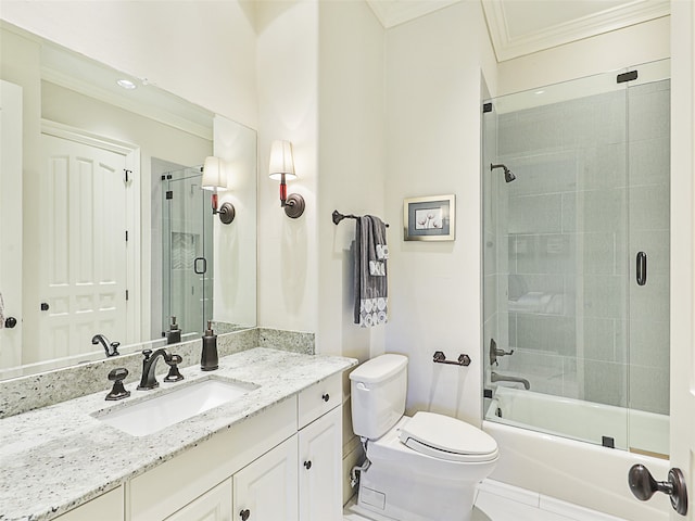 full bathroom with vanity, ornamental molding, shower / bath combination with glass door, and toilet