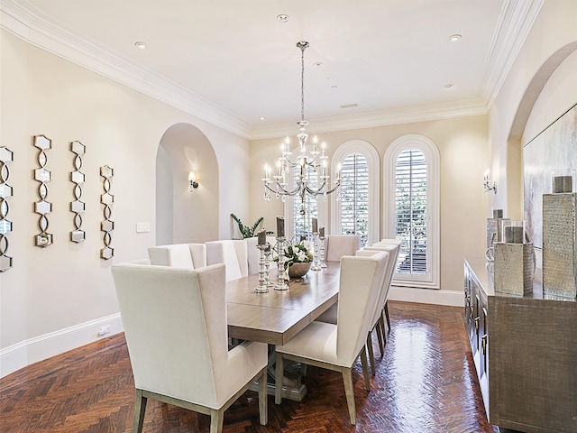 dining area featuring a chandelier, crown molding, and dark parquet flooring