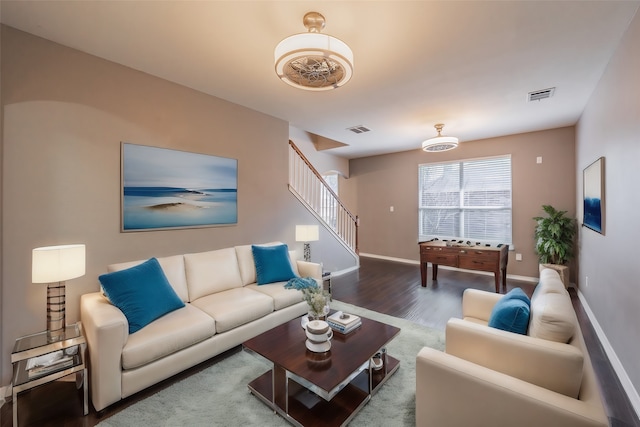 living room featuring dark hardwood / wood-style floors