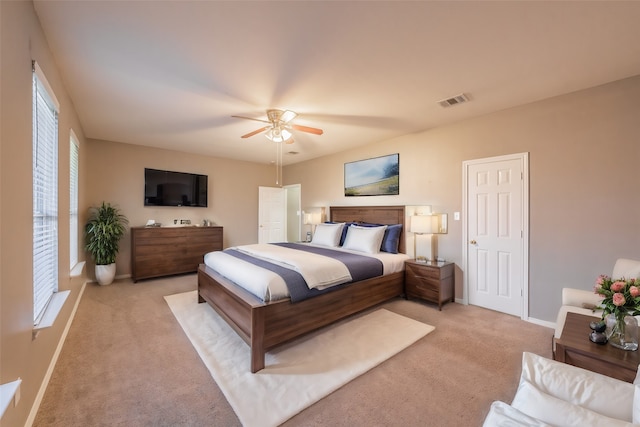 carpeted bedroom with ceiling fan