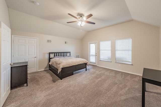 bedroom with ceiling fan, carpet flooring, and vaulted ceiling