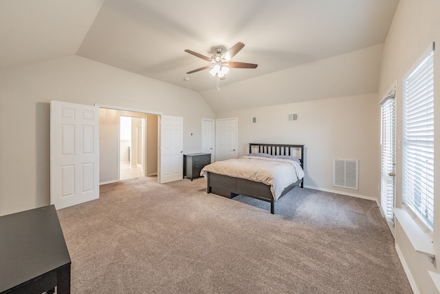 bedroom with light carpet, vaulted ceiling, and ceiling fan