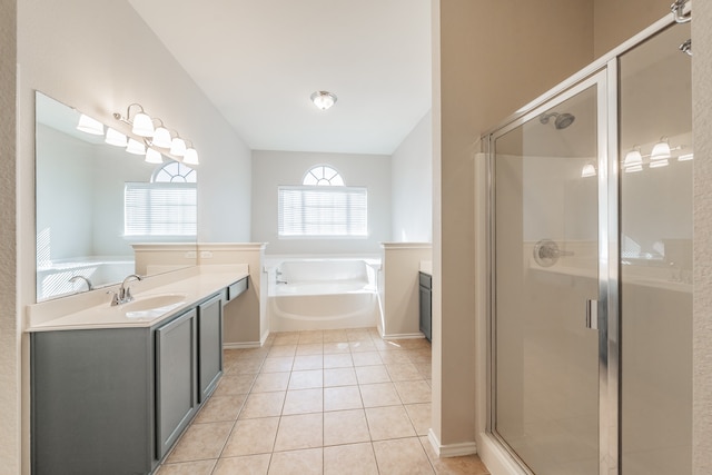 bathroom featuring vanity, tile patterned floors, plus walk in shower, and plenty of natural light