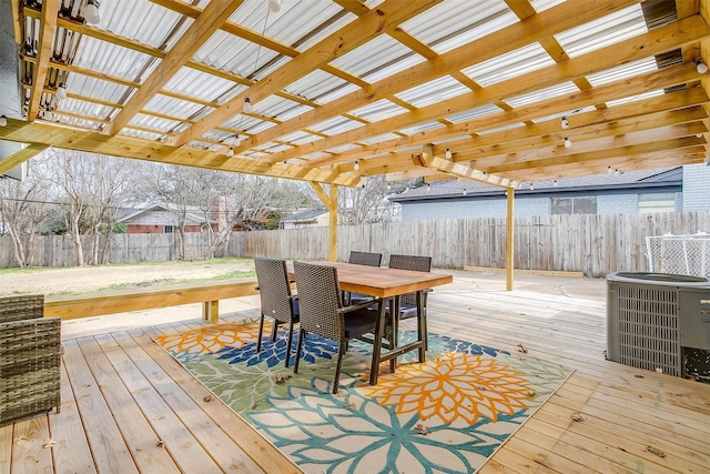 wooden deck with central AC unit and a pergola