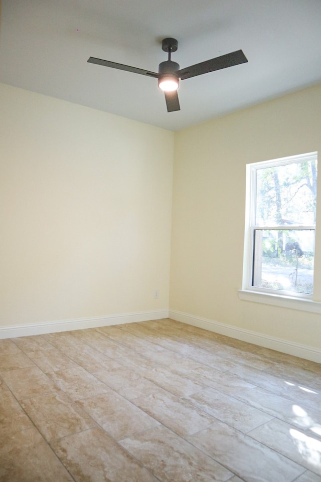 unfurnished room featuring ceiling fan