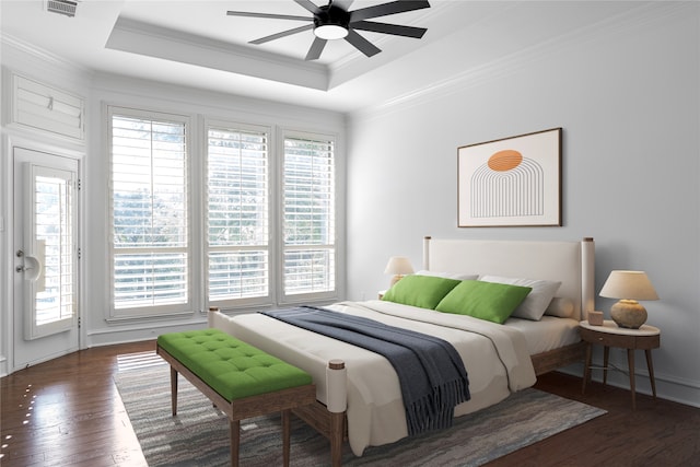 bedroom featuring a raised ceiling, ceiling fan, crown molding, and dark wood-type flooring