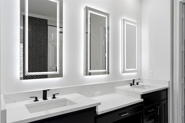 bathroom featuring vanity and crown molding