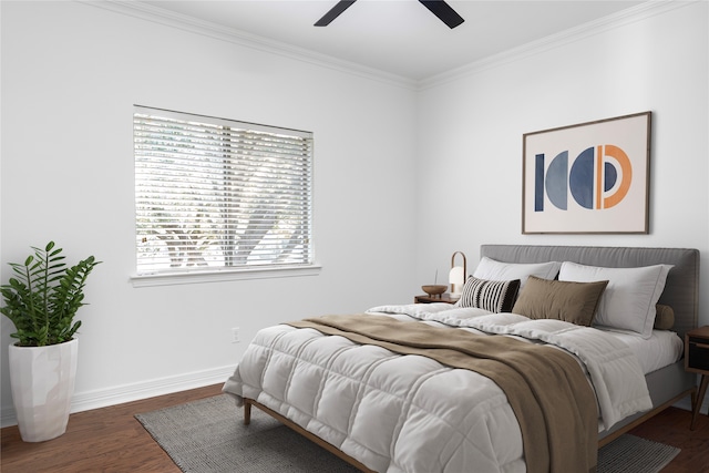 bedroom featuring ceiling fan, crown molding, and dark hardwood / wood-style floors