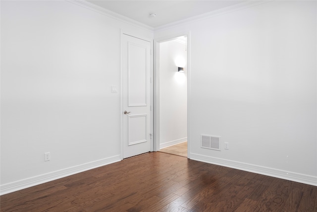 unfurnished room featuring hardwood / wood-style floors and ornamental molding