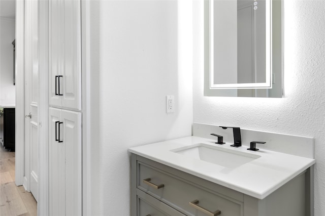 bathroom featuring vanity and wood-type flooring