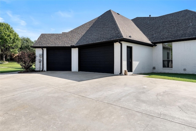 view of side of home with a garage