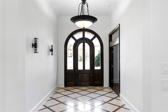 foyer featuring ornamental molding