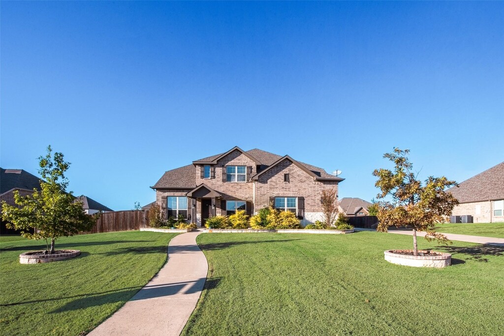 347 Ash Brook Ln, Sunnyvale, TX 75182 - view of front of home featuring brick siding, a front yard, and fence