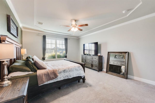 bedroom featuring baseboards, ornamental molding, visible vents, and light colored carpet