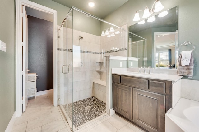 full bathroom with a stall shower, tile patterned flooring, vanity, and a bath