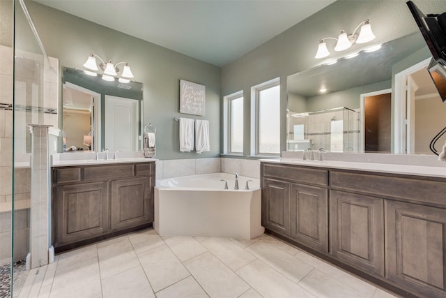 bathroom with tile patterned floors, vanity, and independent shower and bath