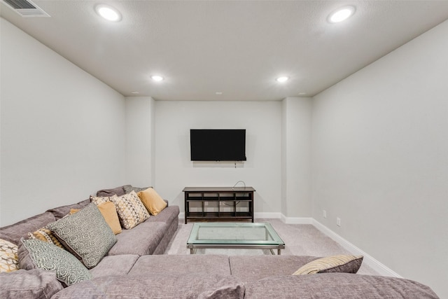 living area featuring carpet, visible vents, baseboards, and recessed lighting