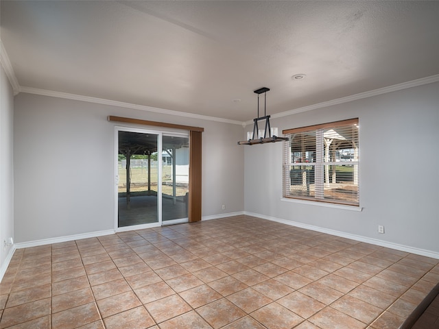 tiled empty room featuring an inviting chandelier and ornamental molding