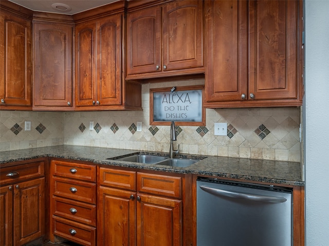 kitchen with sink, dark stone countertops, decorative backsplash, and dishwasher