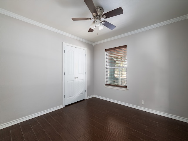 unfurnished bedroom with ornamental molding, a closet, dark hardwood / wood-style floors, and ceiling fan