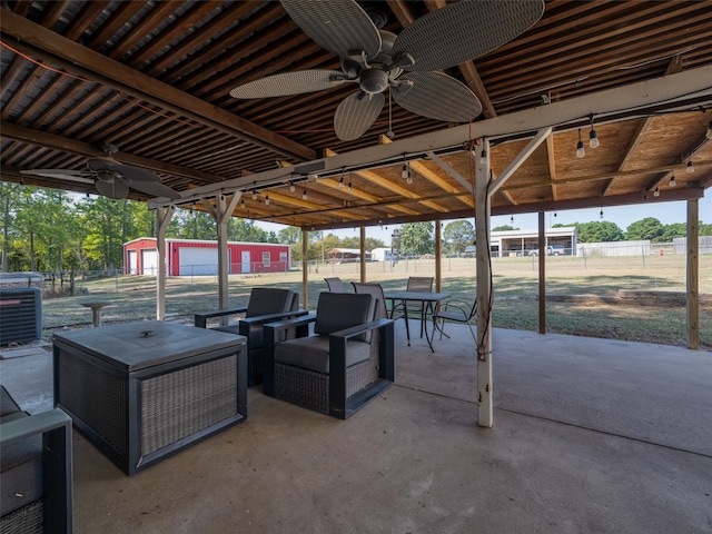 view of patio featuring central air condition unit, a storage unit, and ceiling fan