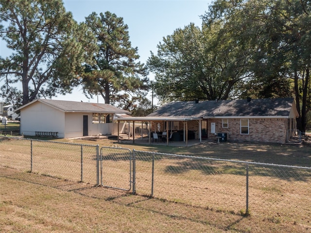 view of front facade featuring a patio and a front yard