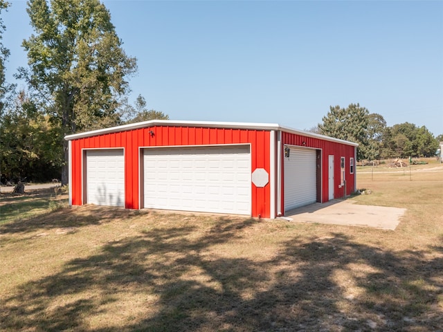 garage featuring a lawn