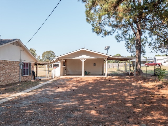 exterior space with a carport