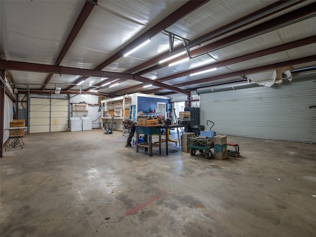 garage featuring washing machine and dryer