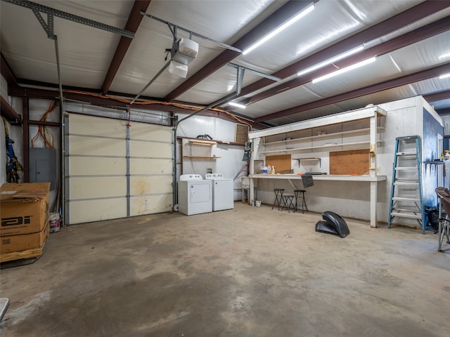 garage featuring a garage door opener and independent washer and dryer