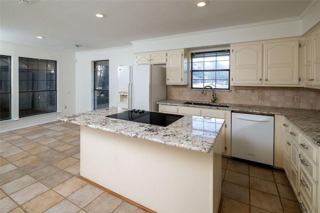 kitchen with a center island, decorative backsplash, sink, and white appliances