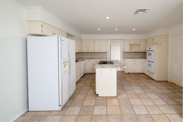 kitchen featuring light tile patterned floors, a kitchen island, backsplash, crown molding, and white appliances