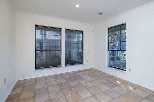 spare room with crown molding