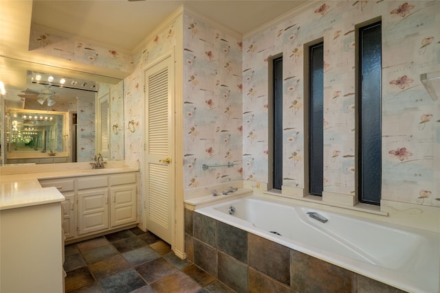 bathroom featuring vanity, crown molding, a relaxing tiled tub, and ceiling fan