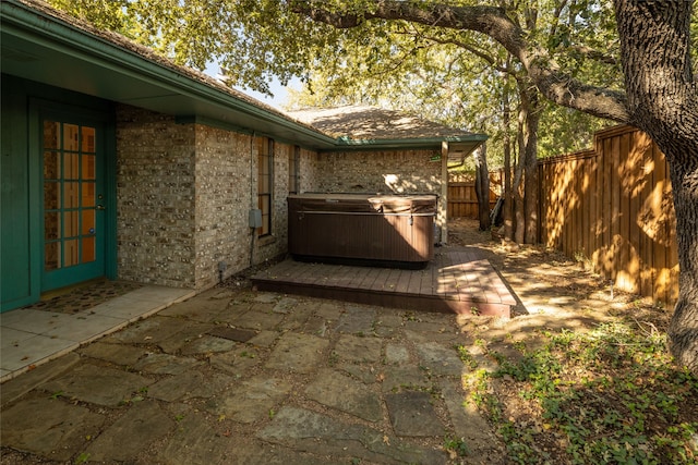 view of patio / terrace featuring a hot tub