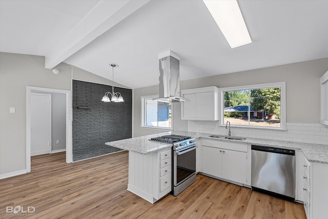 kitchen featuring sink, island exhaust hood, lofted ceiling with beams, stainless steel appliances, and white cabinets