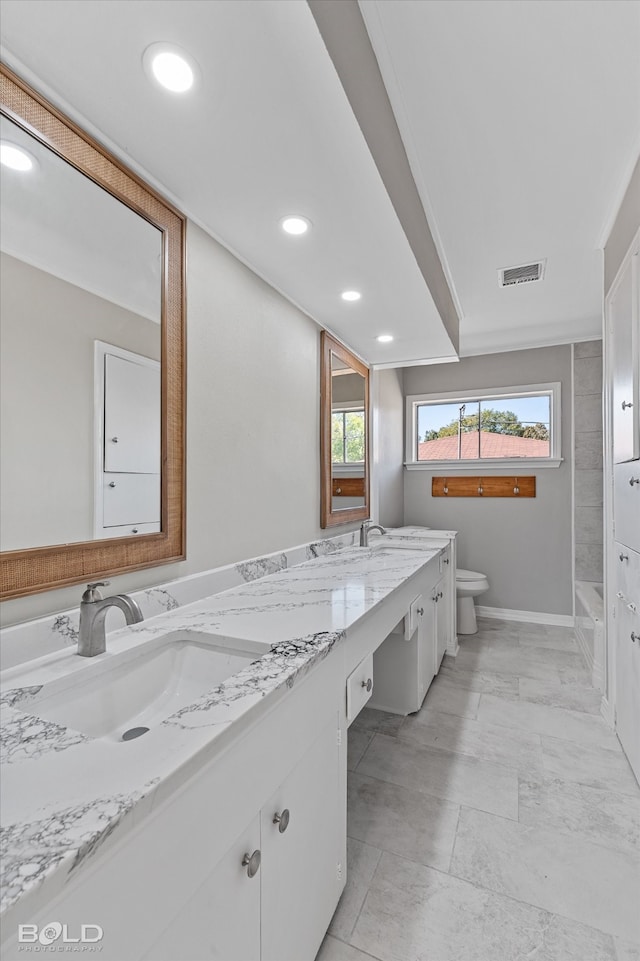 bathroom featuring vanity and toilet