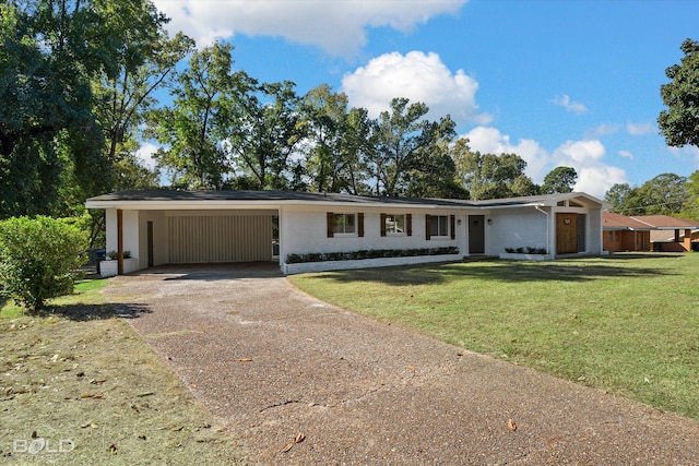 ranch-style house with a front lawn and a carport