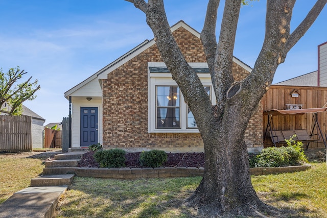 view of front of home with a front lawn