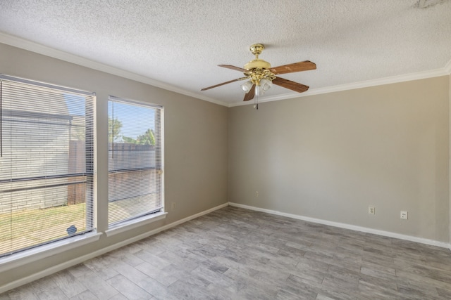 empty room with crown molding, a textured ceiling, and ceiling fan