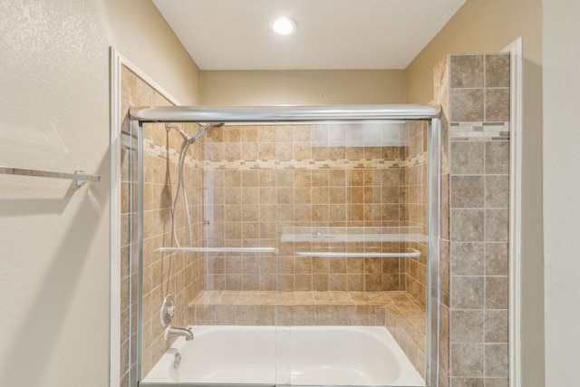 bathroom featuring enclosed tub / shower combo